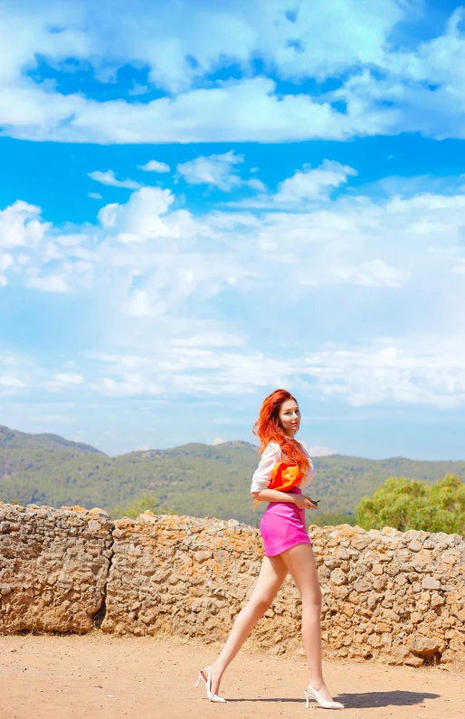 a woman in shorts and a white top