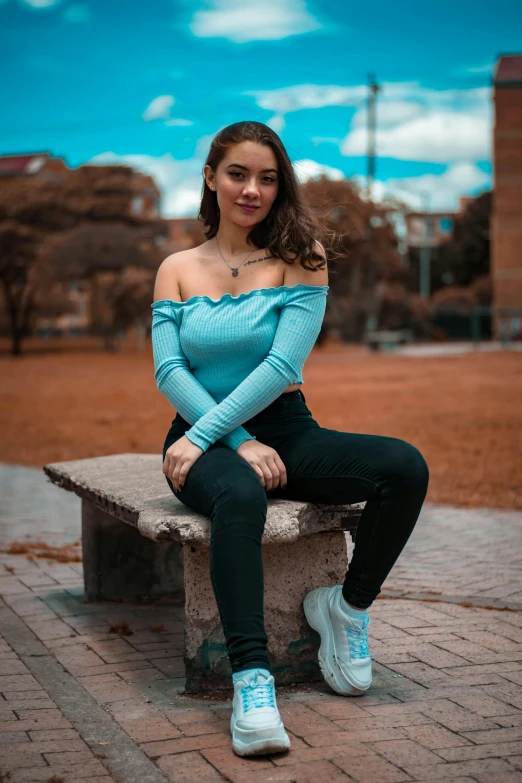 an image of a woman sitting on a bench