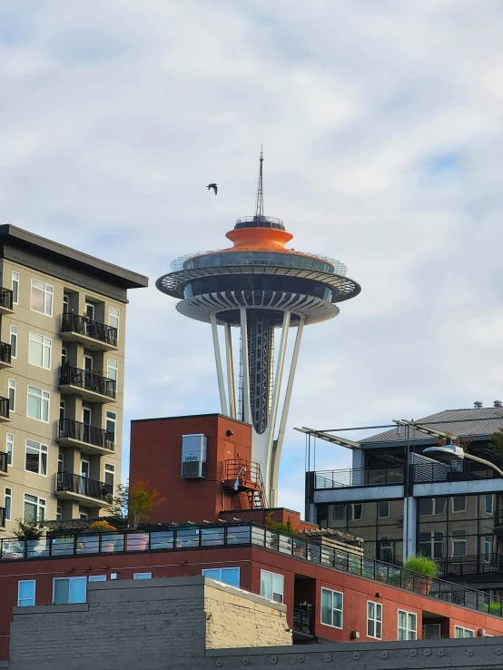 a very large modern architecture structure towering over the city