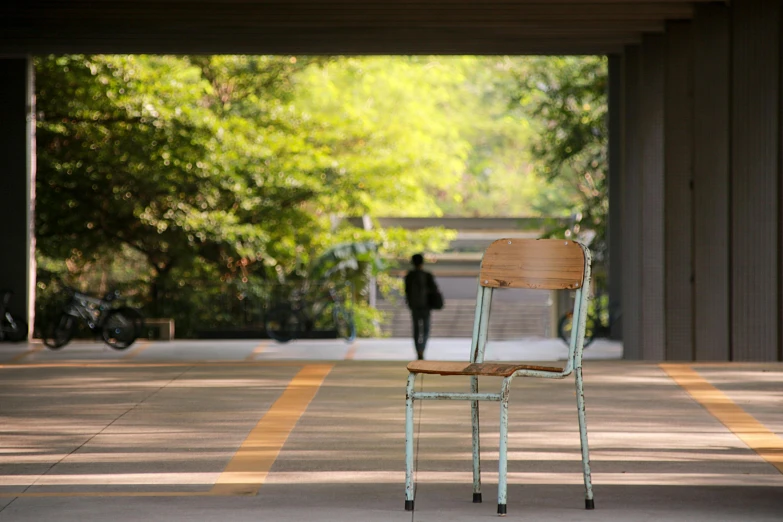 a wooden chair that is on the ground