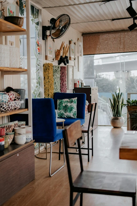 some chairs and table in a small room