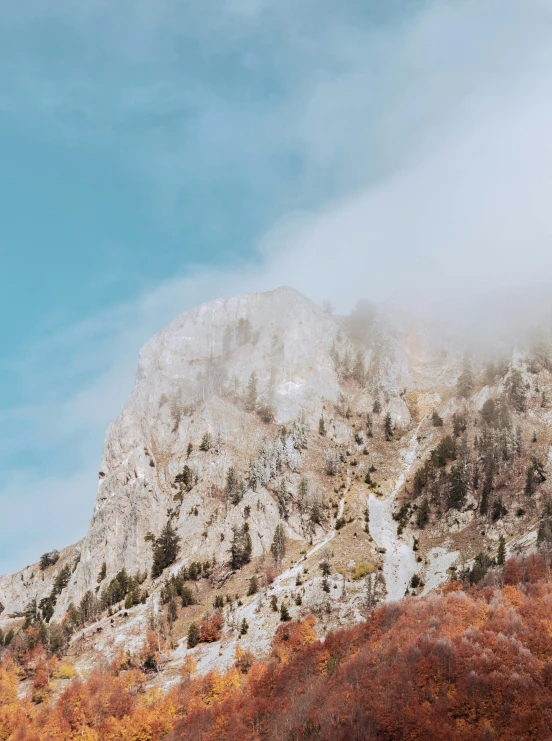 the mountain tops stand on the hazy autumn morning