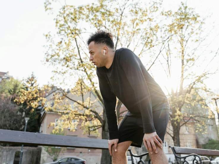 the young man has his feet on a skateboard