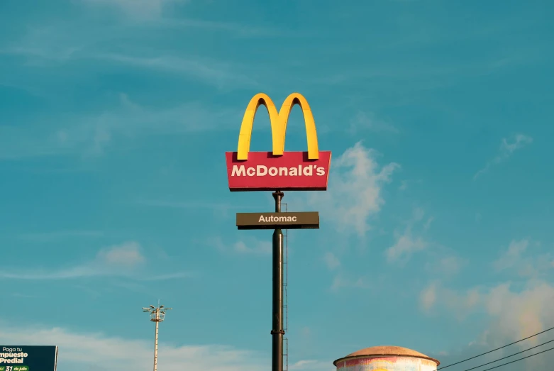 a large mcdonalds sign on top of a building