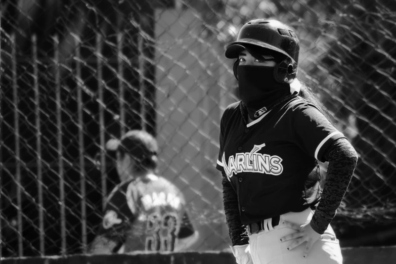 a black and white image of a catcher and batter