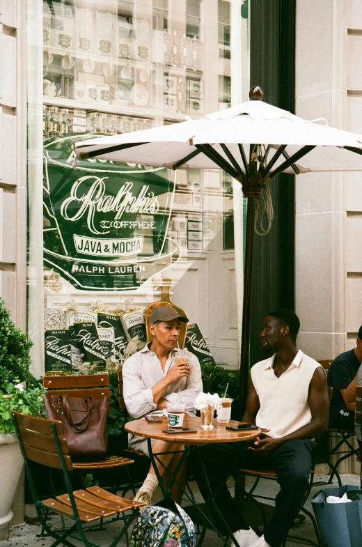 some people sitting outside at a table