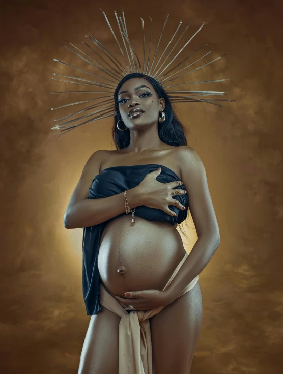 a woman wearing a body paint, is depicted as if she is pregnant