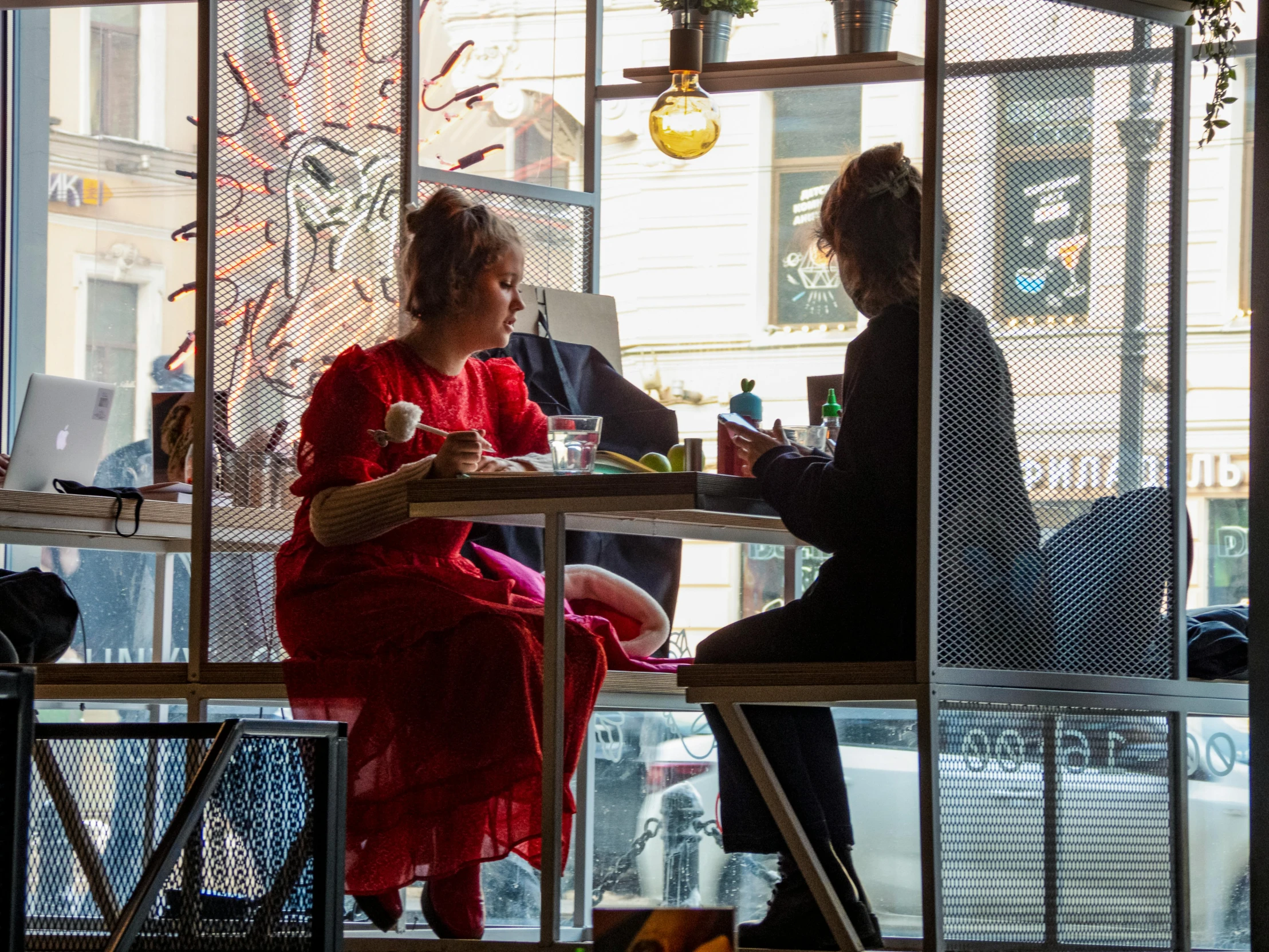 two women at a table in a city restaurant