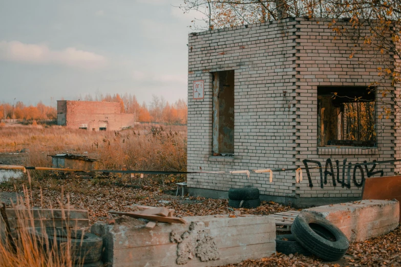 an old brick building with some writing on the side