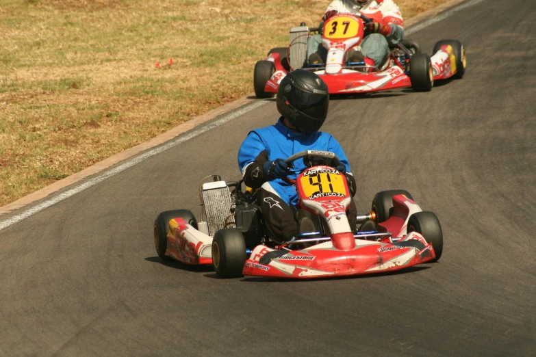 two s are racing cars around the track