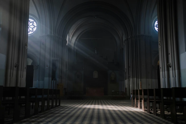 a large church with stained glass windows and a checkered floor