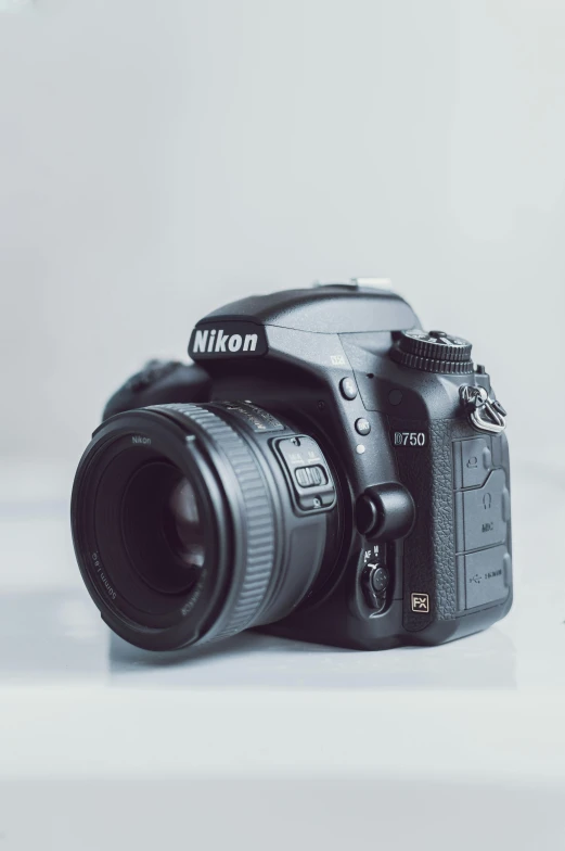 a black digital camera sitting on top of a table