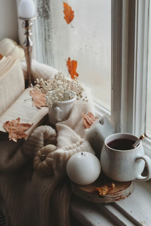 a table topped with coffee cups sitting on top of a wooden slice