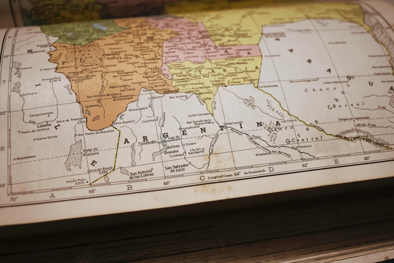 a map is placed on top of the wooden surface