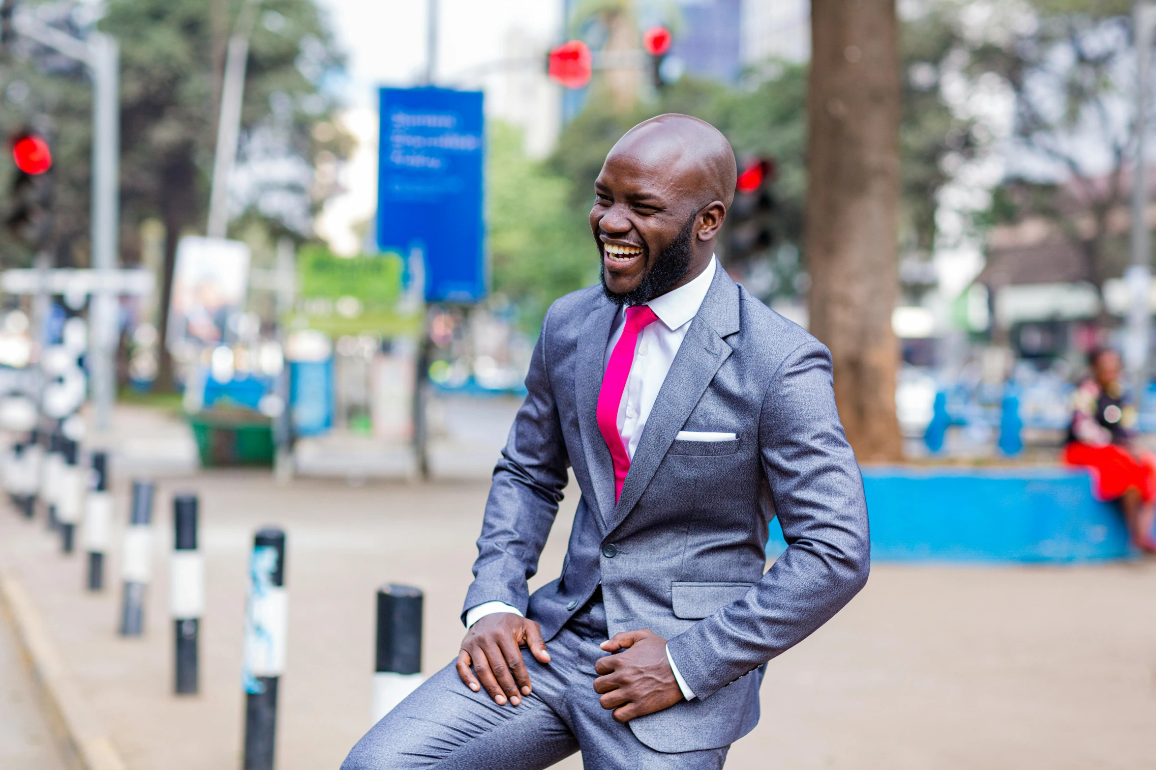 an african american man in a suit poses for a po