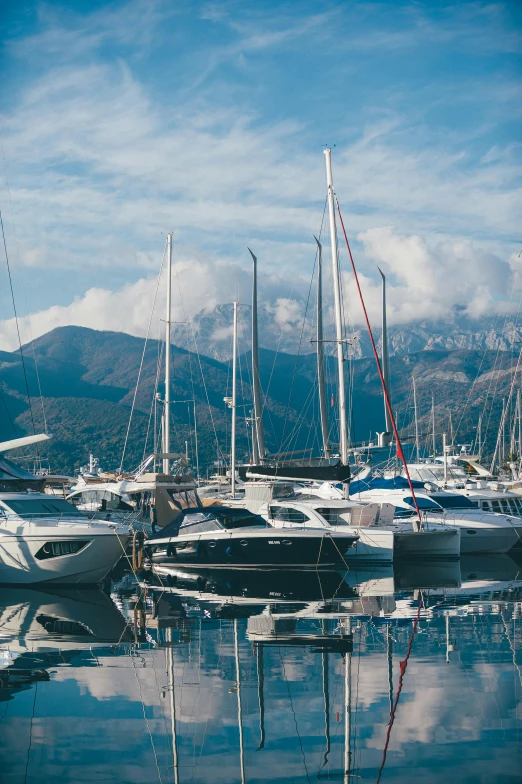 a couple of boats floating next to each other on top of a lake