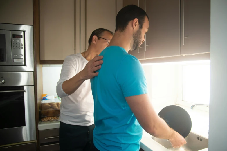 a man and a woman are in the kitchen