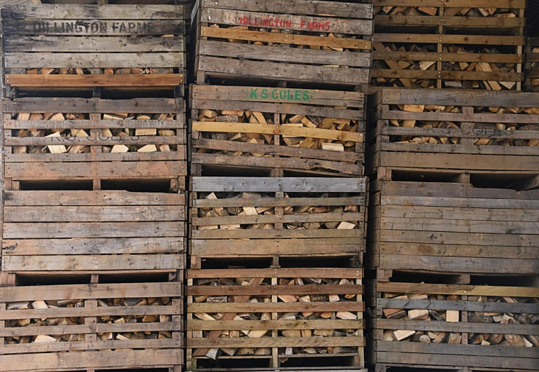 many different wooden pallets stacked up