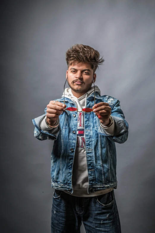 a man standing with some string in his hand