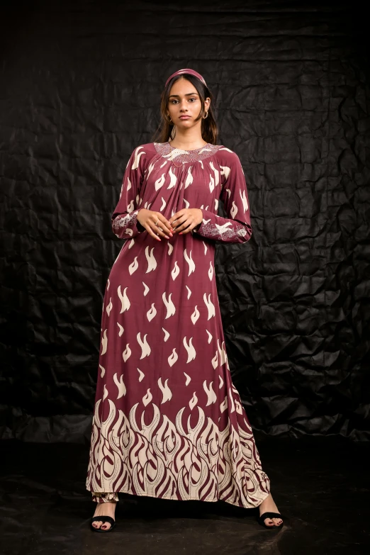 a woman in an indian dress on black background