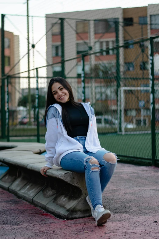 a women who is sitting on a bench