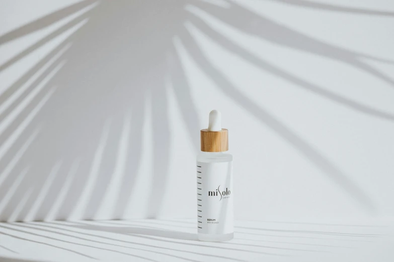 a bottle of makeup on the white background with shadow