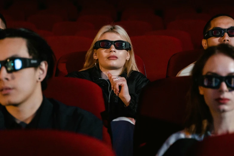 people wearing 3d glasses in the theater