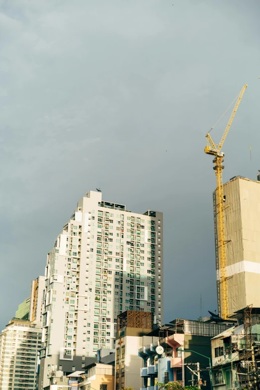 tall buildings sit next to each other near one another