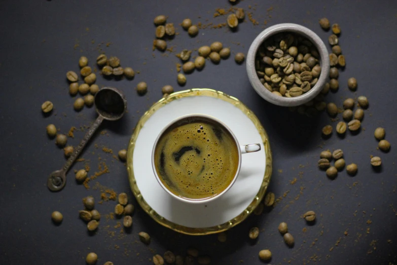 a cup of coffee surrounded by seeds