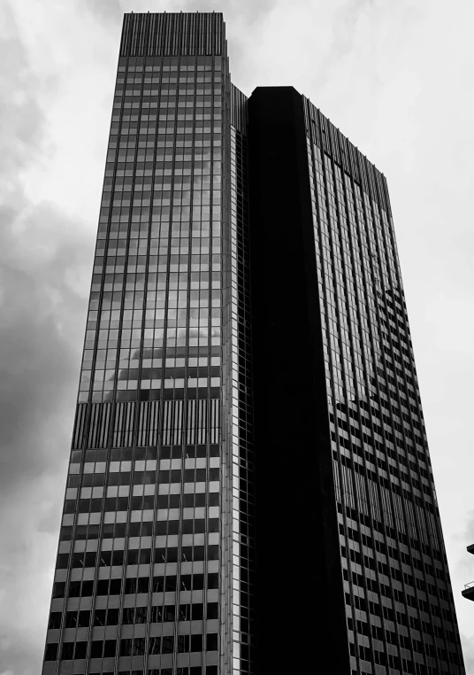 two large buildings next to each other with windows