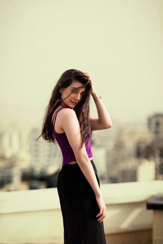 woman with long dark hair in the city