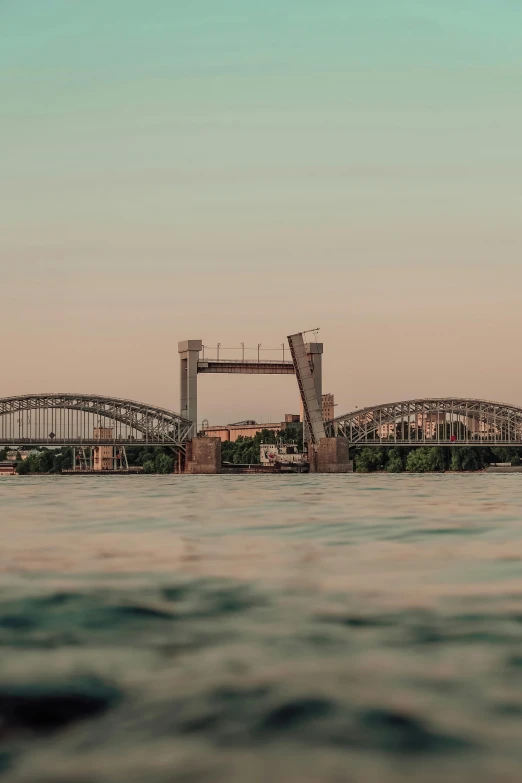 this is a beautiful view from the water of the bridge