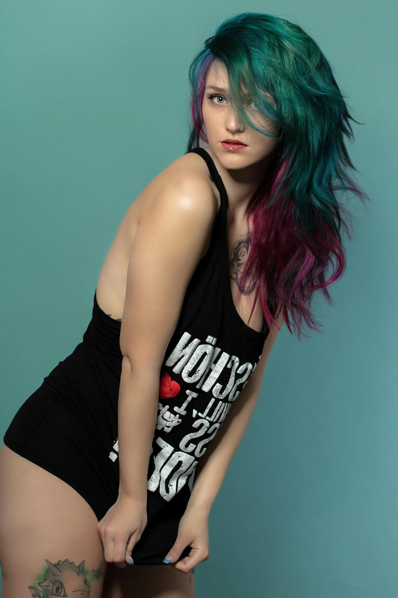 a woman with purple hair is posed