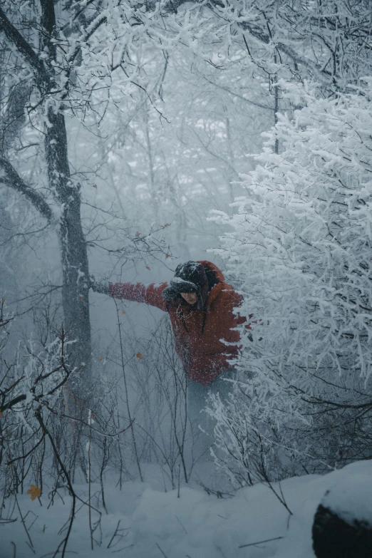 snowboarder sliding down a snowy mountain side