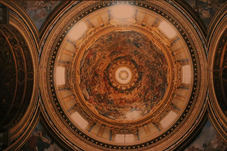 looking up at a domed ceiling of a building