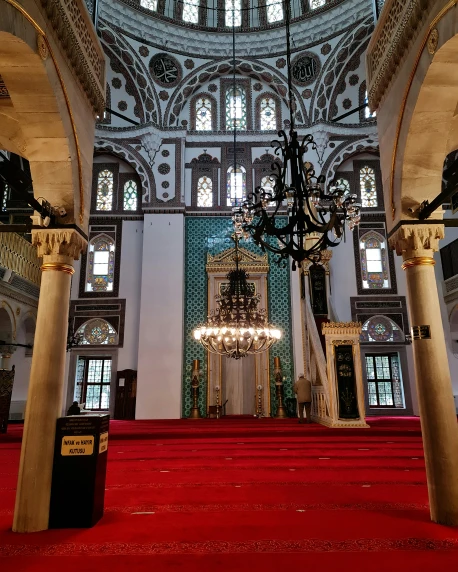 a big cathedral with a red carpet and chandelier