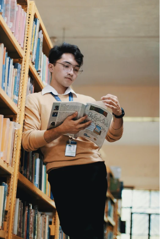 the student is reading at the liry