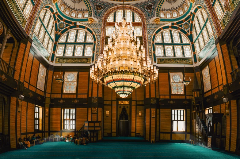 a chandelier hangs above the grand entry hall