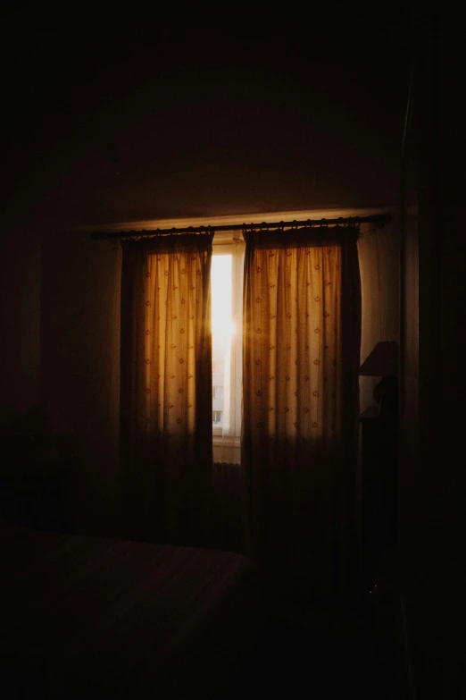 a bedroom scene with the light coming through the window