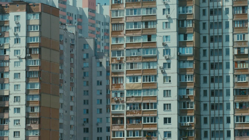 a row of multi - story buildings in an urban area