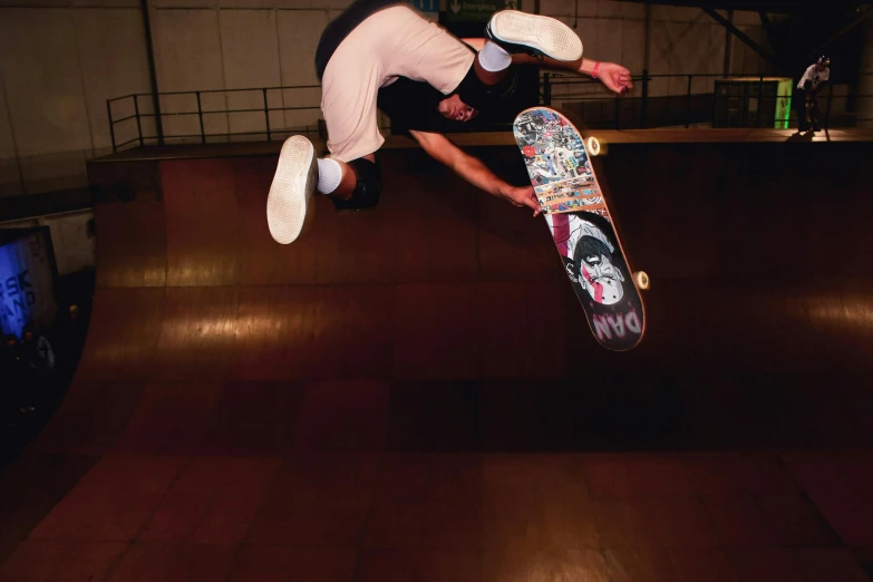 the skateboarder is riding the skate board on a ramp