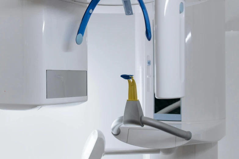 a toothbrush in front of a wall mounted sink