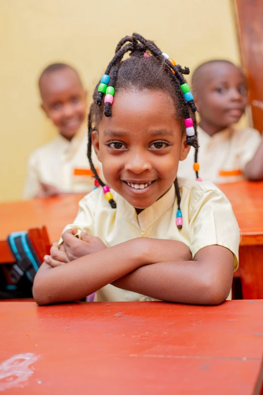 a  smiling with several little girls