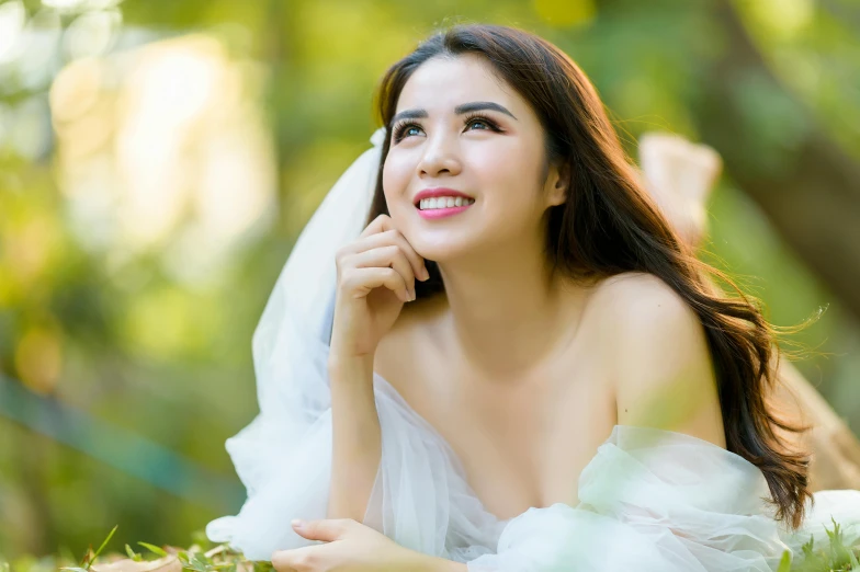 a woman wearing a white wedding dress posing for a po