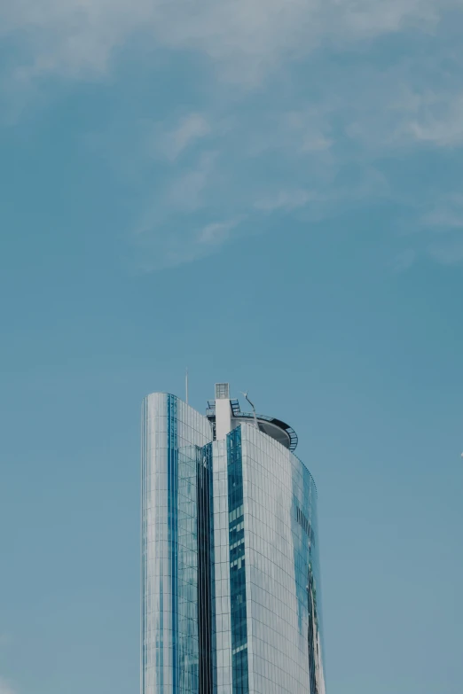 an airplane in the air in front of some buildings