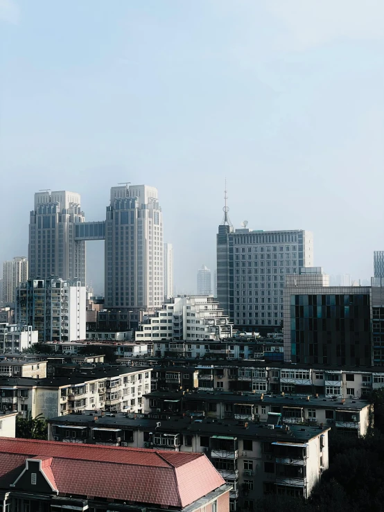 large city buildings surrounding each other on a hazy day