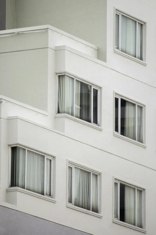 an image of a building with the reflection of windows on it