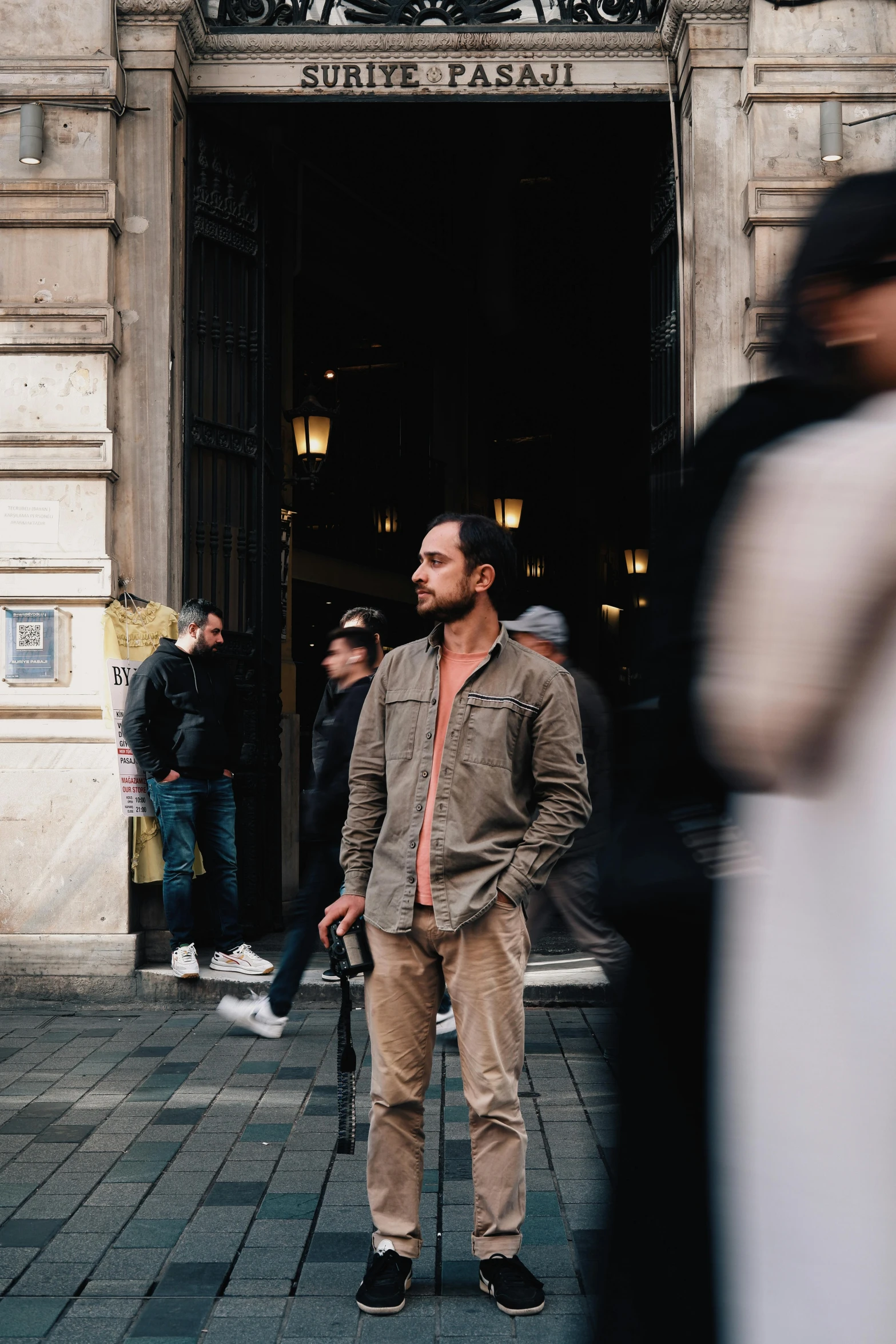 a man standing in front of a building