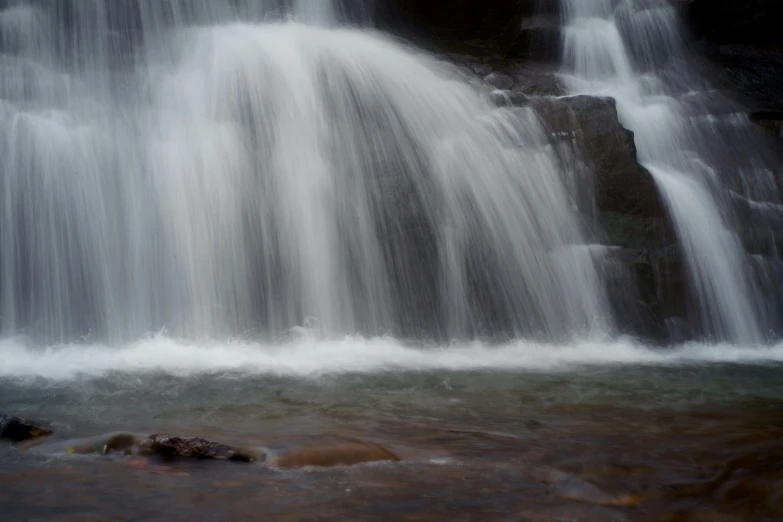 a waterfall that has been partially obscured by water