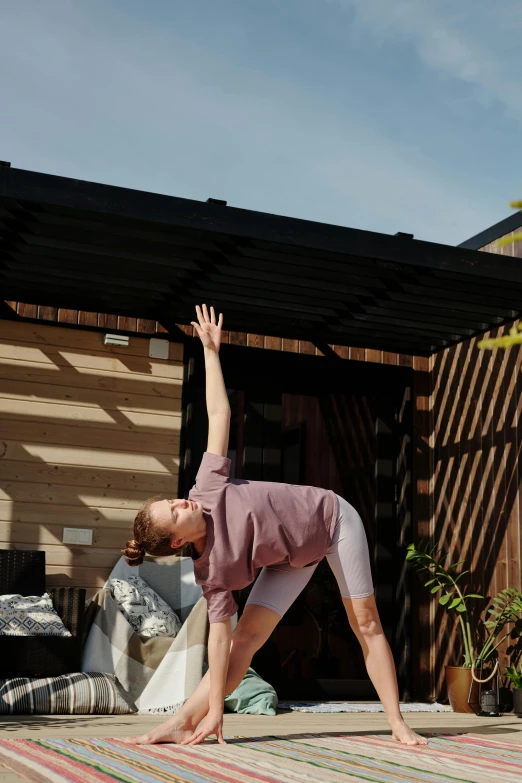 a man stands on one foot on the ground and looks up